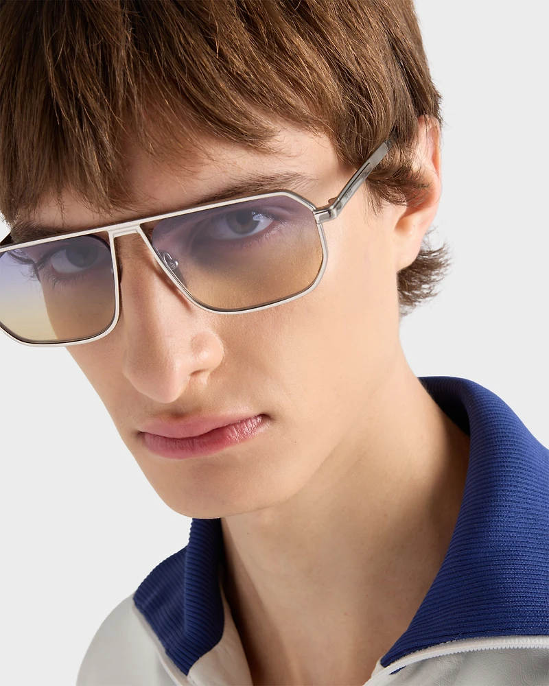 Sunglasses with the iconic metal plaque