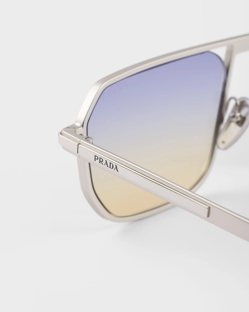 Sunglasses with the iconic metal plaque