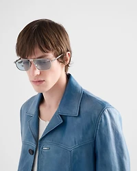Sunglasses with the iconic metal plaque
