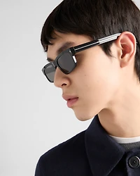 Sunglasses with the iconic metal plaque