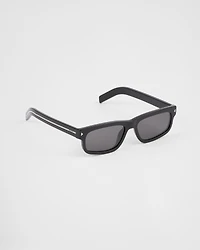 Sunglasses with the iconic metal plaque