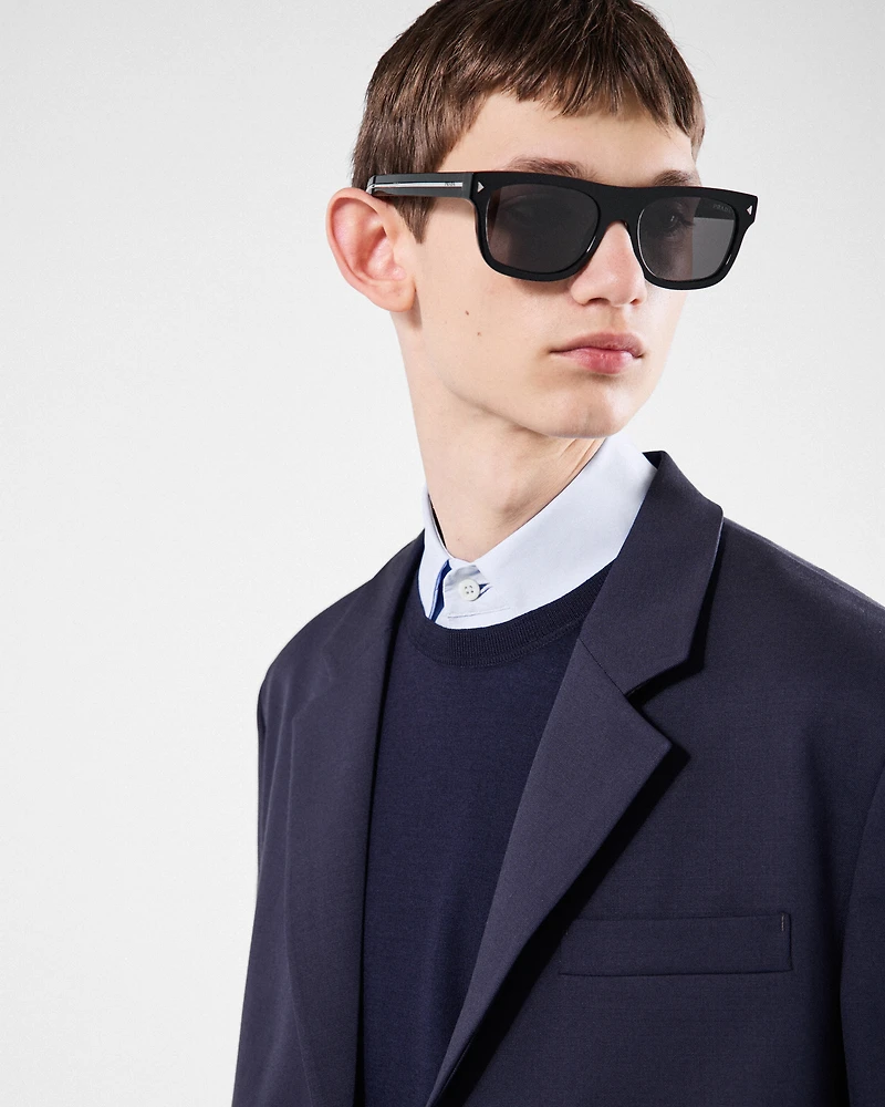 Sunglasses with the iconic metal plaque