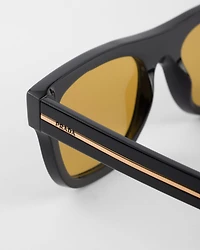 Sunglasses with the iconic metal plaque