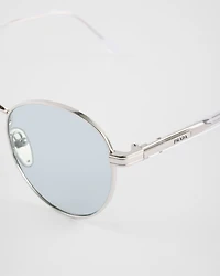 Sunglasses with the iconic metal plaque