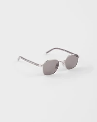 Sunglasses with the iconic metal plaque