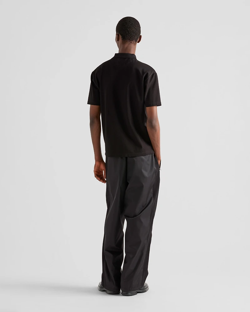 Piqué polo shirt with Re-Nylon details