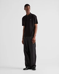 Piqué polo shirt with Re-Nylon details