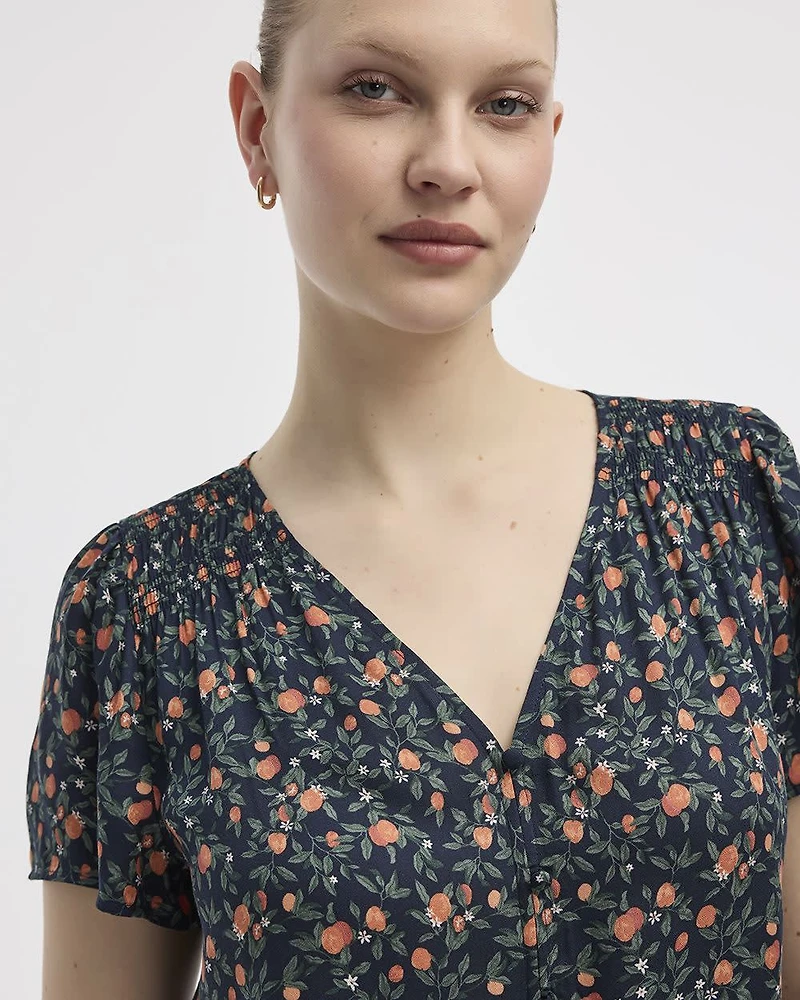 Blouse à col V et manches courtes à volants