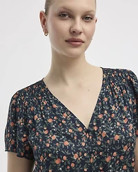 Blouse à col V et manches courtes à volants