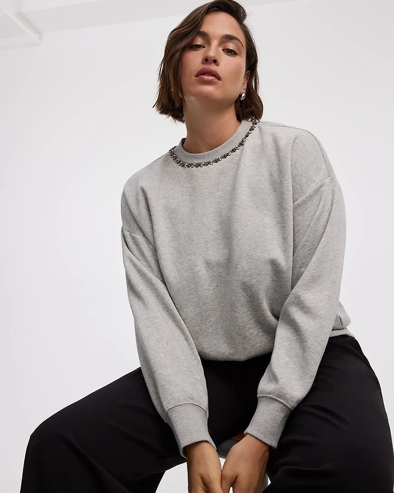 Pull en molleton à manches longues et col rond avec strass