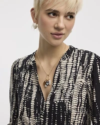 Puffy-Sleeve Split-Neck Blouse