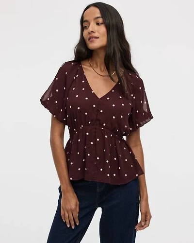 Blouse à manches courtes bouffantes et col V