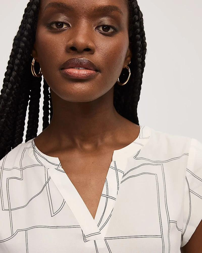 Blouse à manches très courtes et col fendu