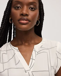 Blouse à manches très courtes et col fendu