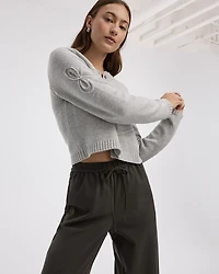Cardigan à manches longues et col rond avec boucles en relief