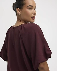 Blouse à manches courtes bouffantes et col rond