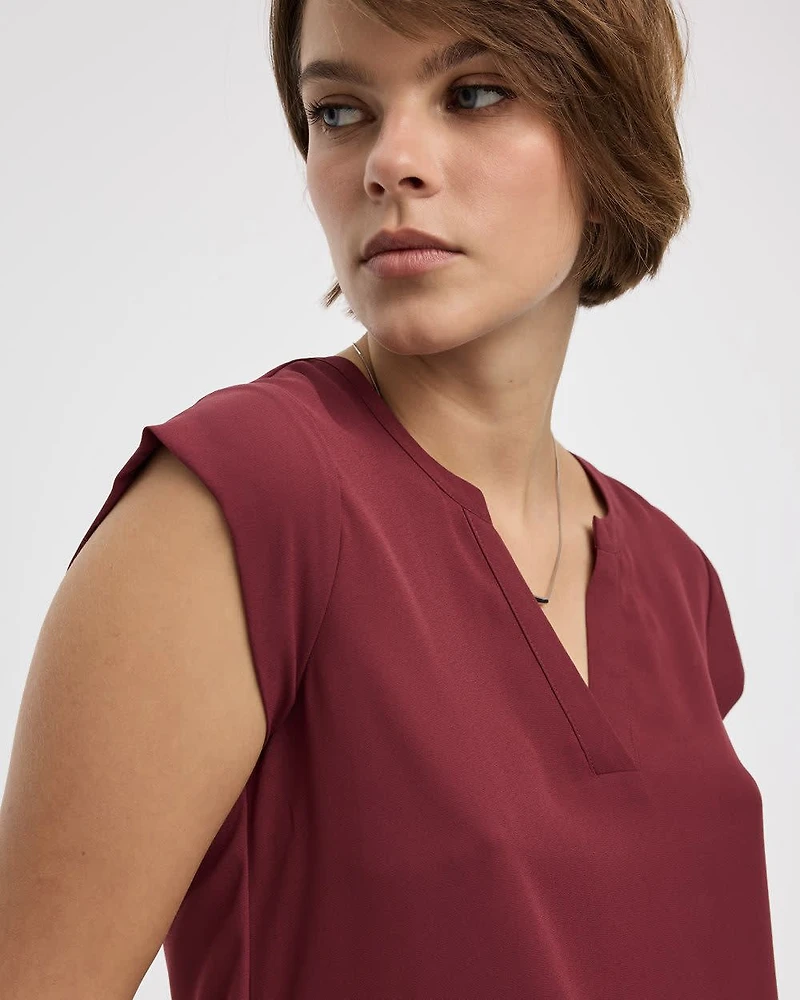 Blouse à manches très courtes et col fendu