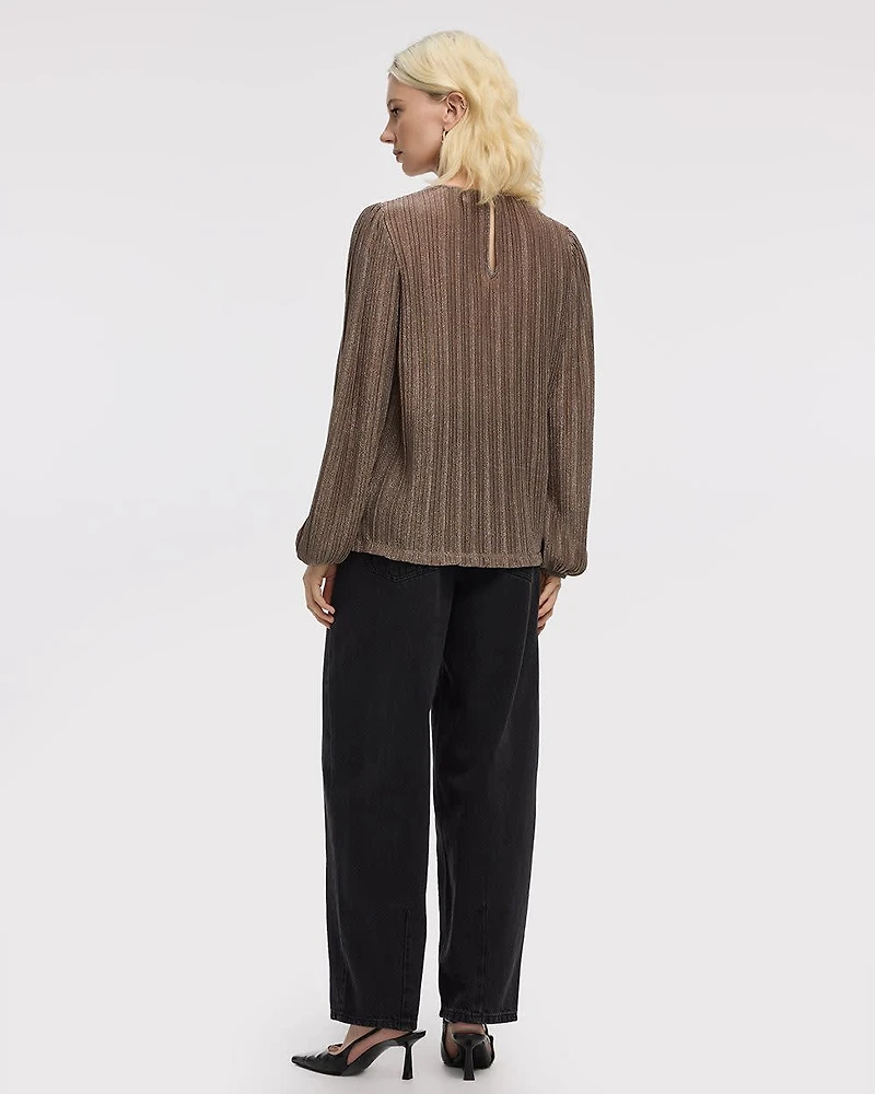 Blouse scintillante à manches longues et col rond