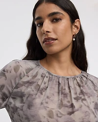 Blouse péplum à manches longues et col rond