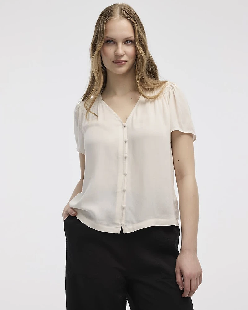 Blouse à col V et manches courtes à volants