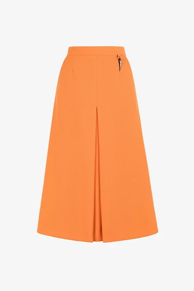 Flared wool skirt with fang pendant