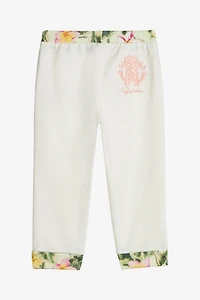 Pants With Embroidered Flowers And RC Monogram