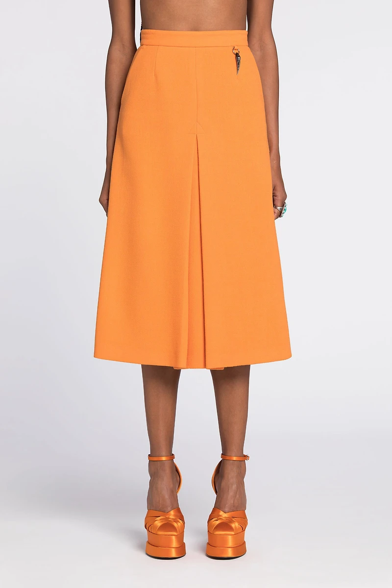 Flared wool skirt with fang pendant