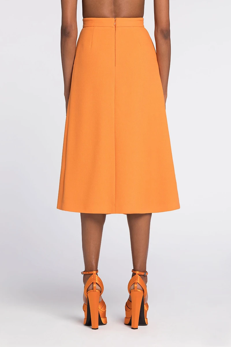 Flared wool skirt with fang pendant