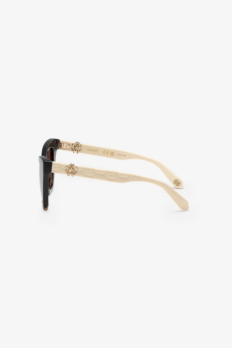 Sunglasses with smooth front and matelassè effect on temples