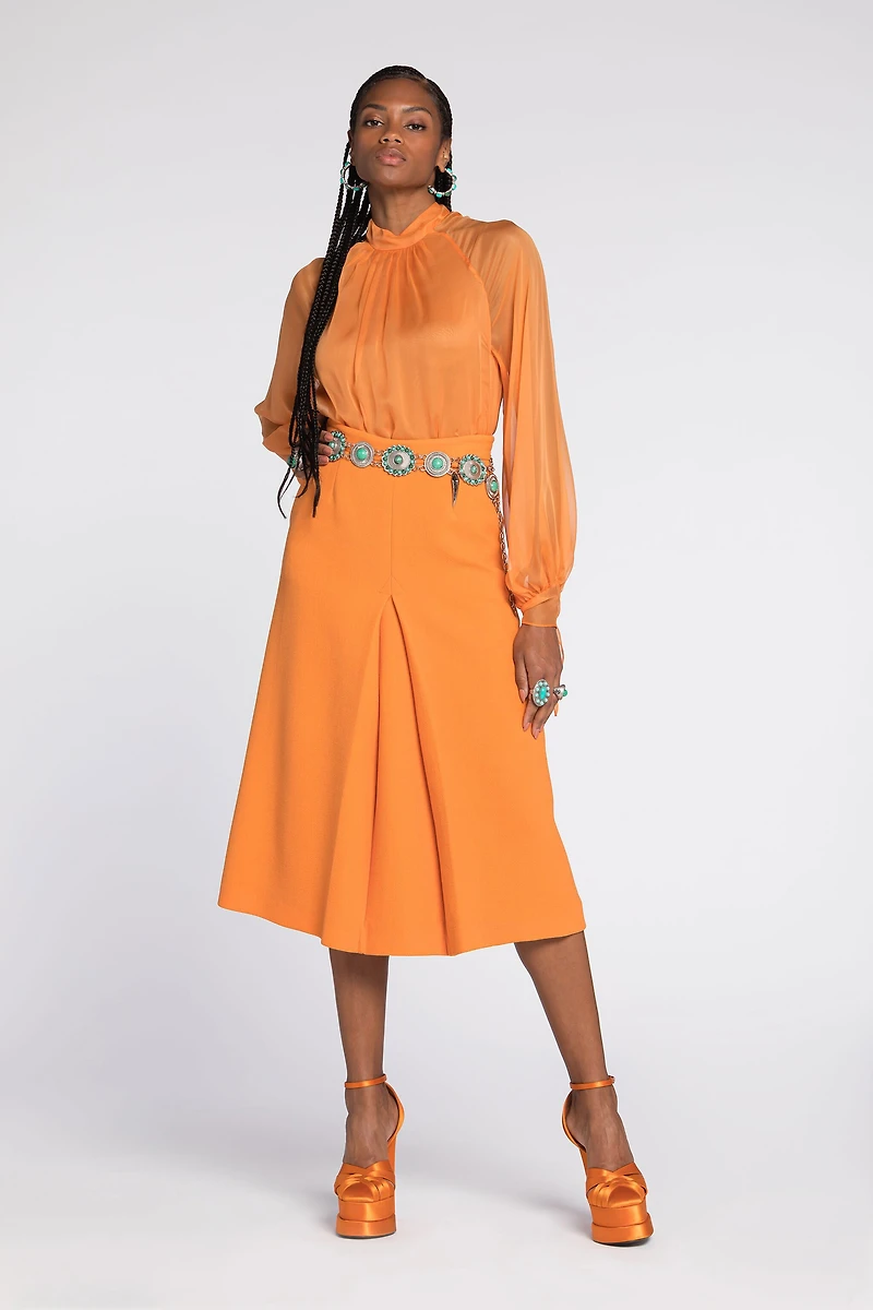 Flared wool skirt with fang pendant