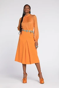 Flared wool skirt with fang pendant