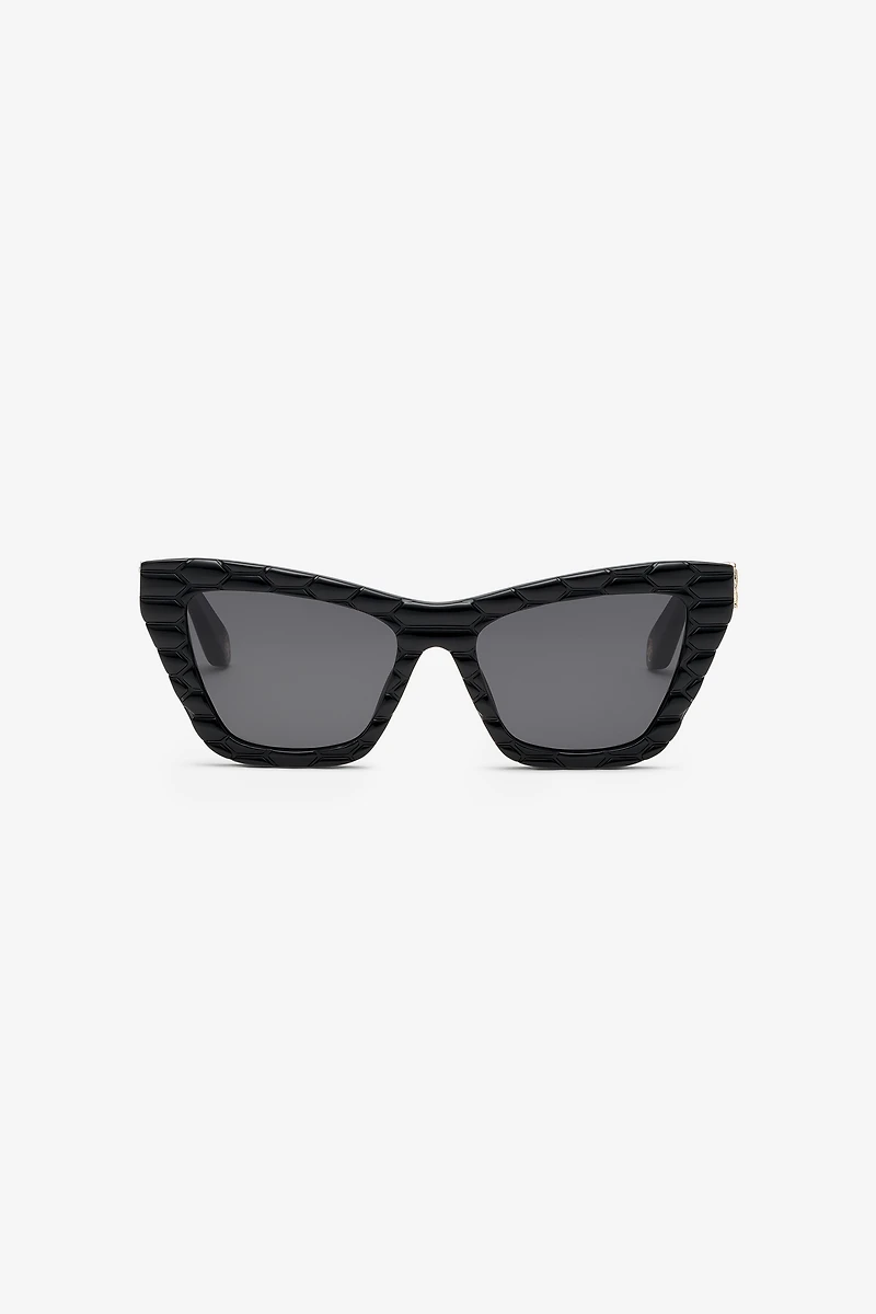 Sunglasses with smooth front and matelassè effect on temples