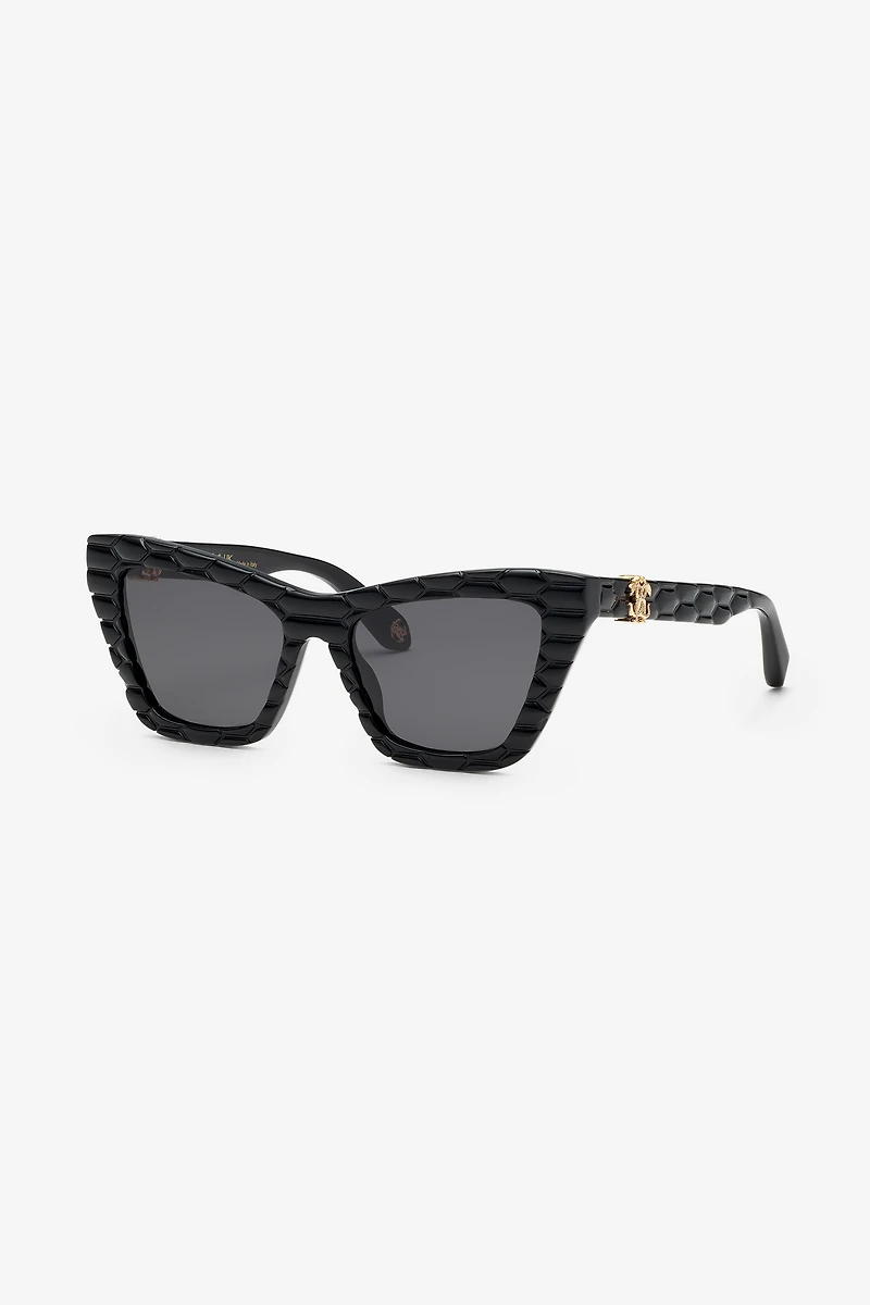 Sunglasses with smooth front and matelassè effect on temples