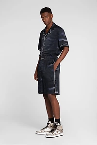 Crocodile print knee-length shorts
