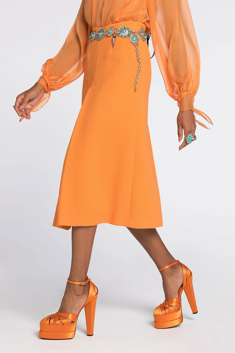 Flared wool skirt with fang pendant