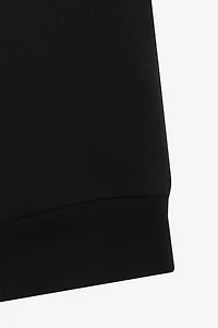Joggers With Rose Print On One Leg