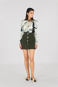 Mini skirt with jewel buttons