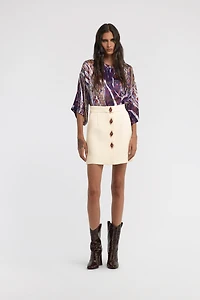 Skirt with jewels buttons