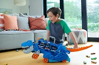 Hot Wheels City Ultimate Hauler, Transforms into a T-Rex with Race Track, Stores 20+ Cars
