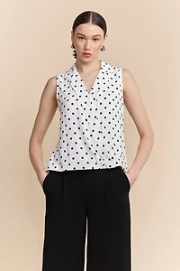 Polka dots sleeveless top with draped front