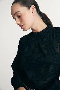 Blouse transparente à texture florale