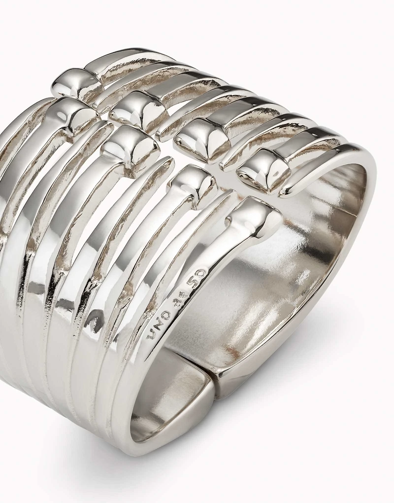 Bangle bracelet with multiple nail heads