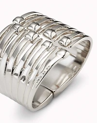 Bangle bracelet with multiple nail heads