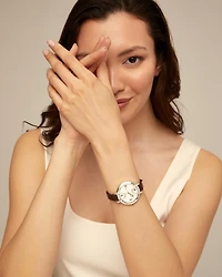 Sterling silver-plated watch with black leather strap and round white dial