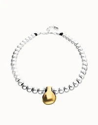 Beaded necklace with medium spheres and a large sphere