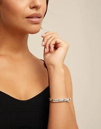 Sterling silver-plated nail shaped bracelet with hidden spring