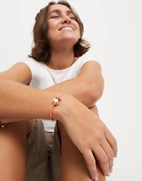 Fuchsia cord bracelet with a pearl