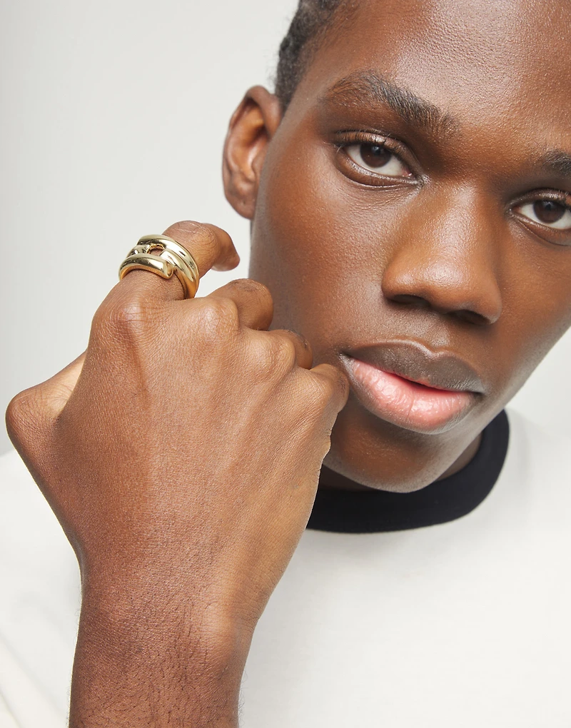 Ring with four intertwined organic shapes