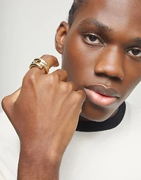 Ring with four intertwined organic shapes