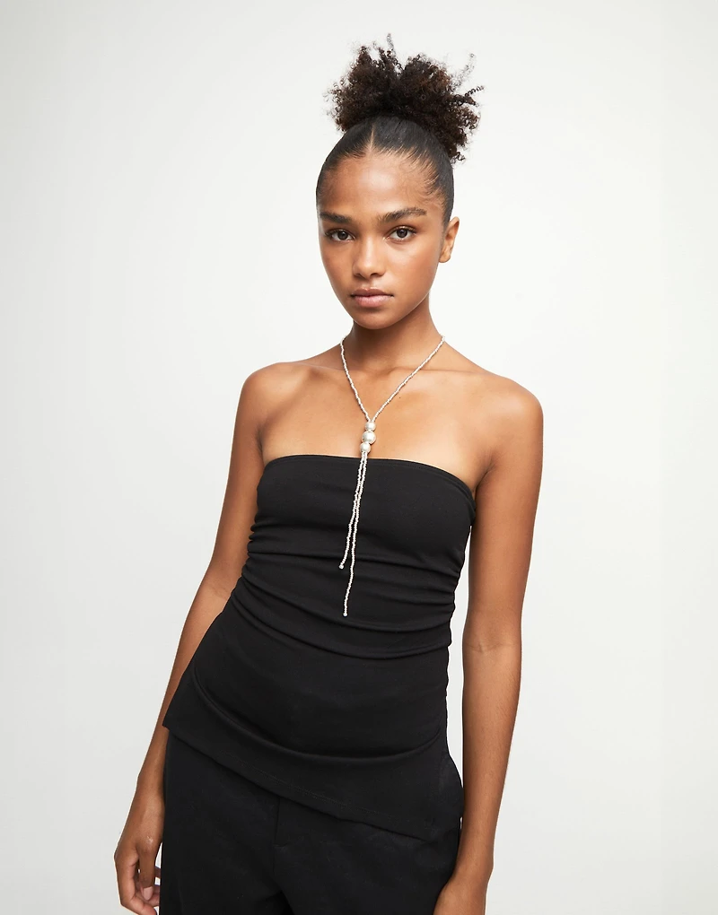 Long bead necklaces with three large central beads